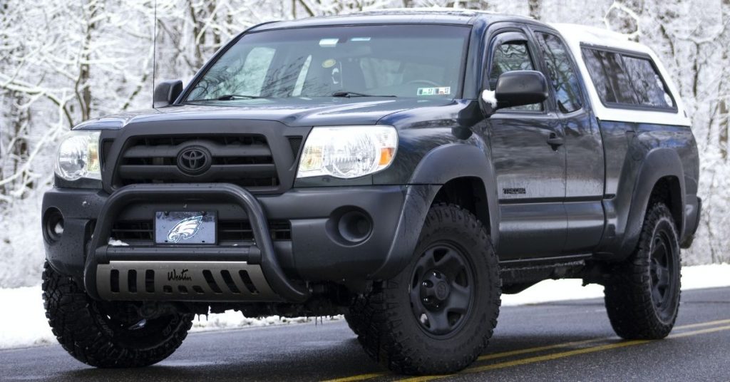 toyota tacoma with truck cap in snow